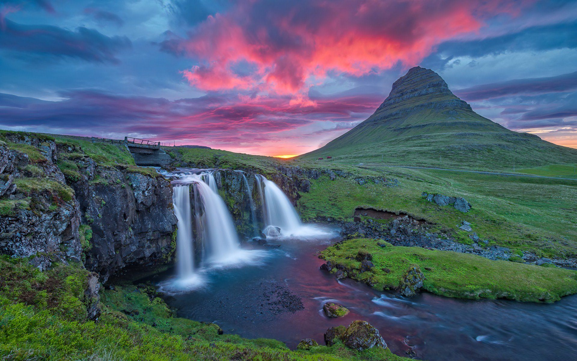 Beautiful-mountain-river-with-waterfall-coast-rock-green-grass