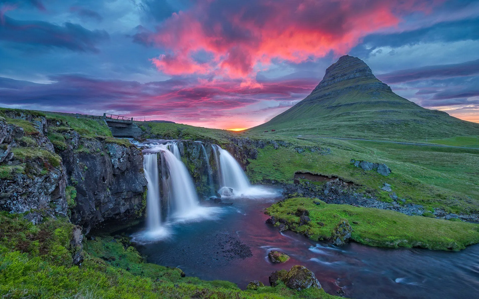 beautiful mountain river with waterfall coast rock green grass